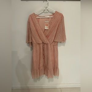 Beautiful pink and white spotted dress size XL from the brand Kirundo.